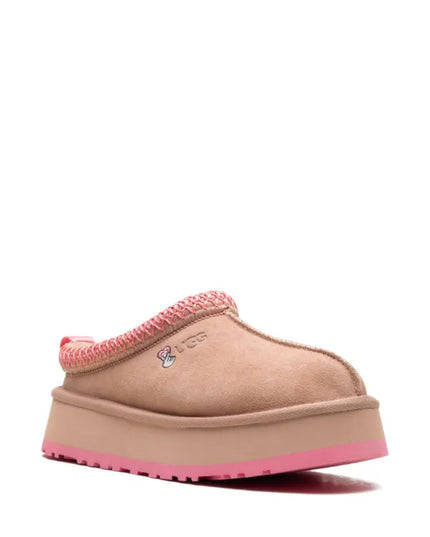 UGG
logo-embroidered shearling ear muffs