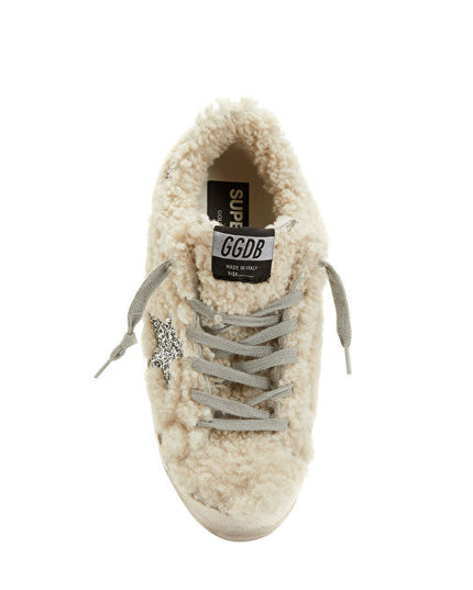 GOLDEN GOOSE
Shearling-panel sneakers