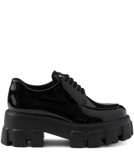 Prada
Monolith patent leather lace-up shoes