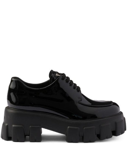 Prada
Monolith patent leather lace-up shoes