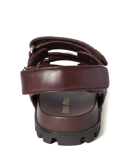 Miu Miu
Sporty matelassé leather sandals