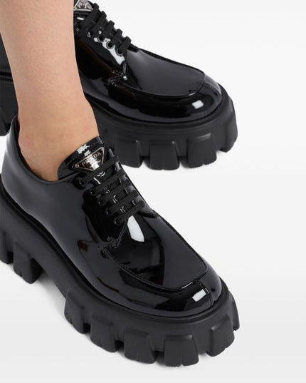 Prada
Monolith patent leather lace-up shoes