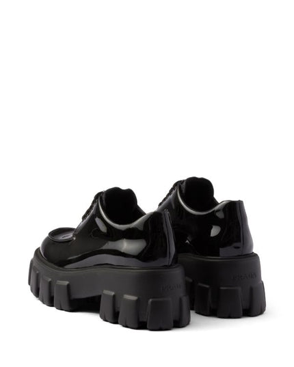 Prada
Monolith patent leather lace-up shoes