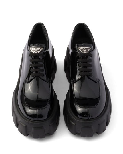 Prada
Monolith patent leather lace-up shoes
