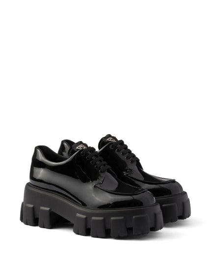 Prada
Monolith patent leather lace-up shoes