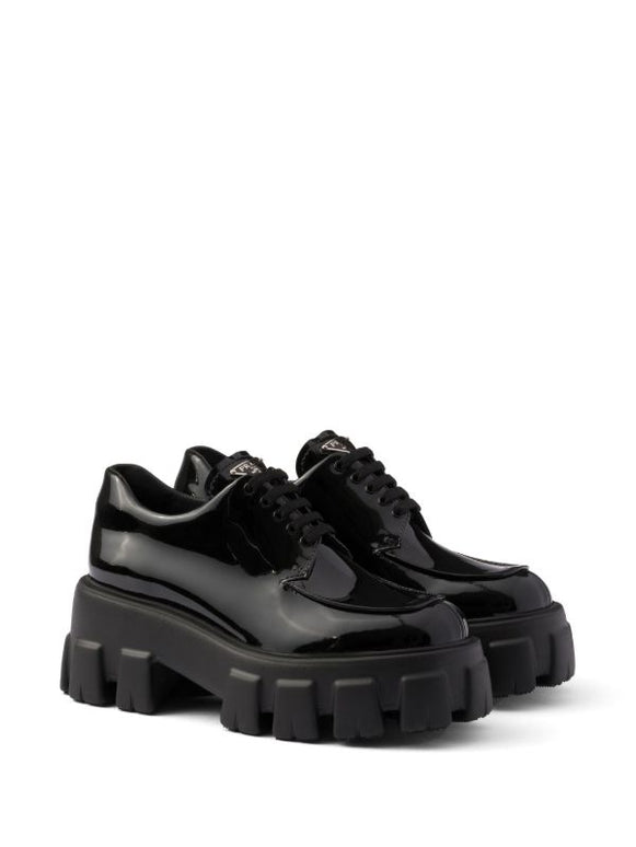 Prada
Monolith patent leather lace-up shoes