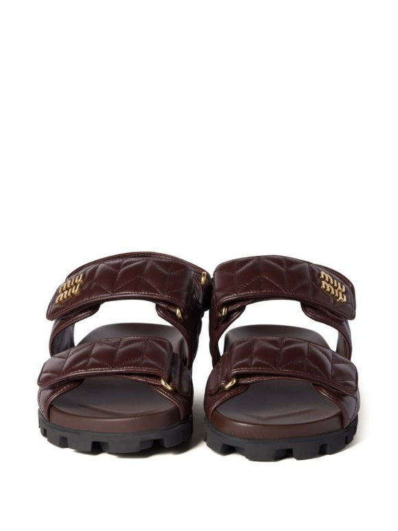 Miu Miu
Sporty matelassé leather sandals